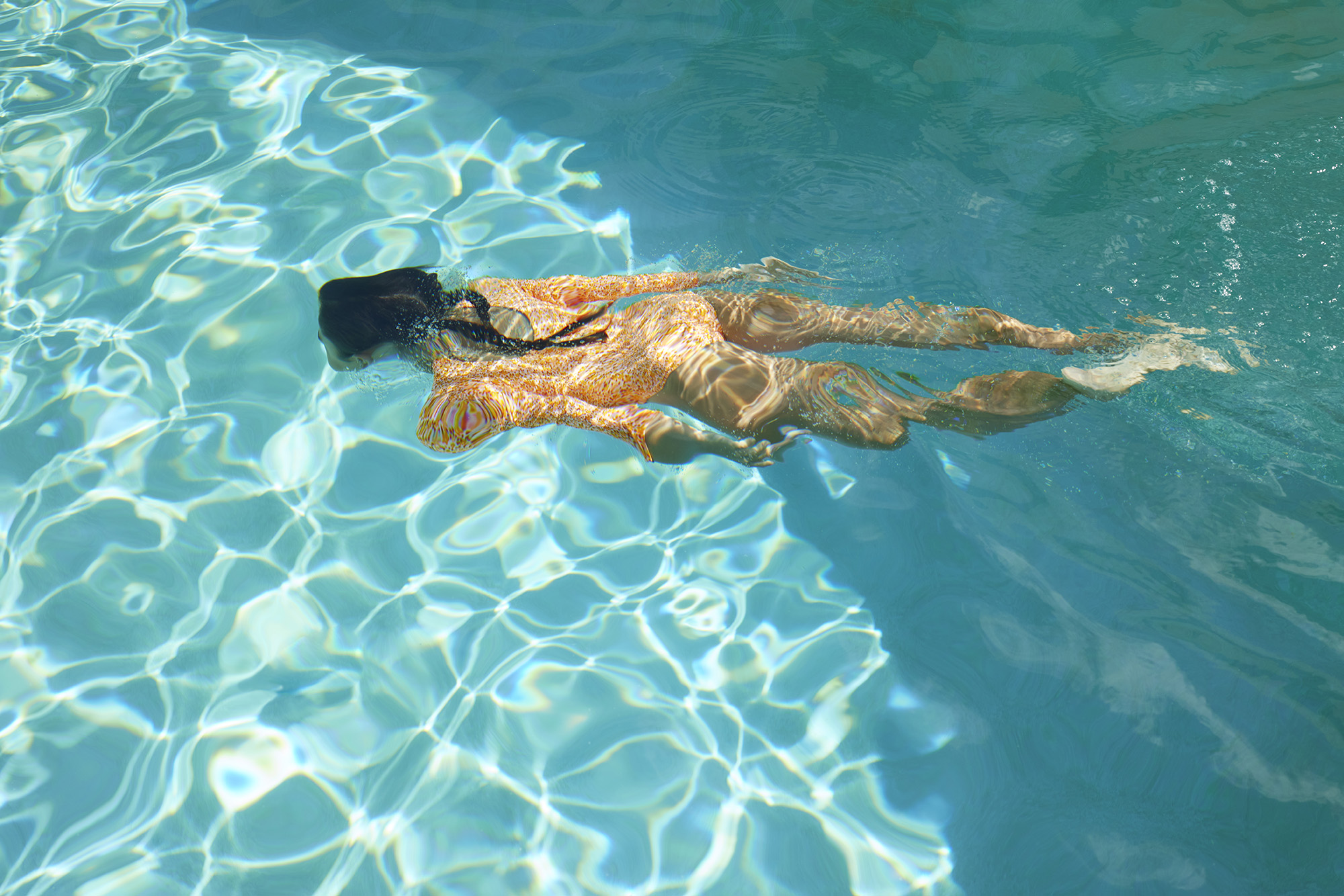 Woman swimming in pool