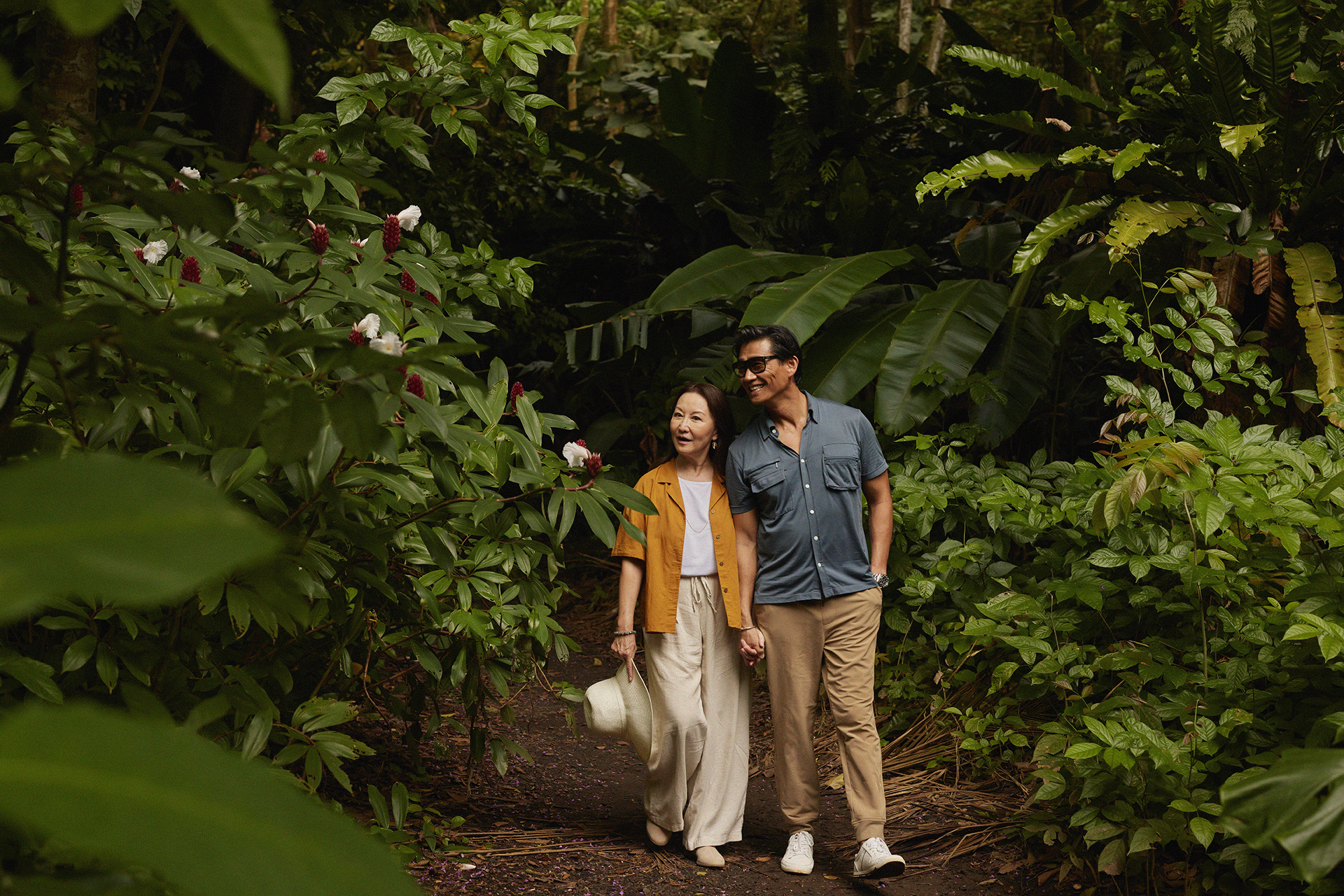 Couple walking in nature path